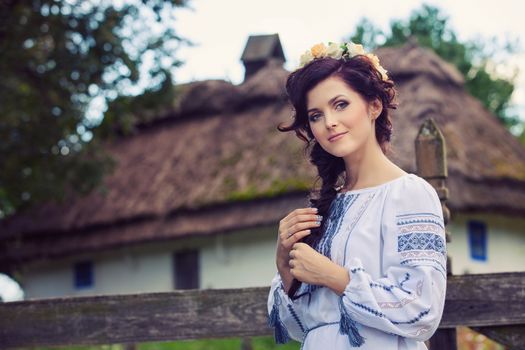 Young beautiful woman in traditional Ukrainian clothing
