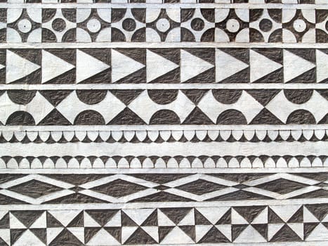 Abstract of a outside wall of a traditional old house in Pirgi of Chios island - Greece; a special traditional tecnique (ksista) is applied on the plaster and the walls are decorated wth geometrical designs or figures and images