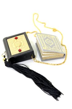 small Quran with Case before light background