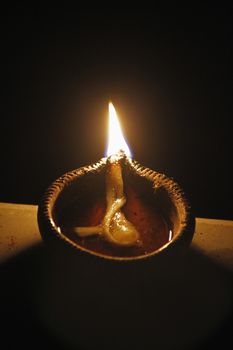 Indian Oil Lamp. An oil lamp is an object used to produce light continuously for a period of time using an oil-based fuel source. The use of oil lamps began thousands of years ago