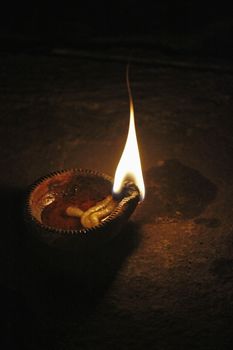 Indian Oil Lamp. An oil lamp is an object used to produce light continuously for a period of time using an oil-based fuel source. The use of oil lamps began thousands of years ago