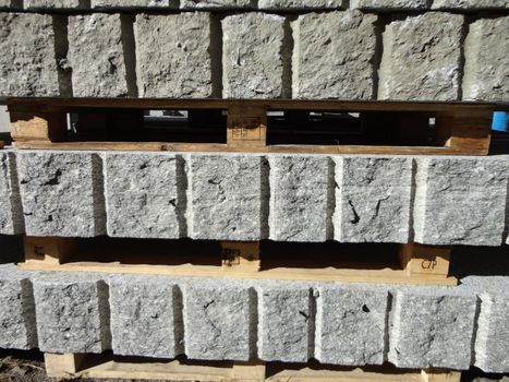 A manufactured industrial cutting of granite rock. Section View.