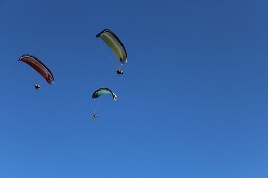 Some pilots, paragliders, make the spectacular perform