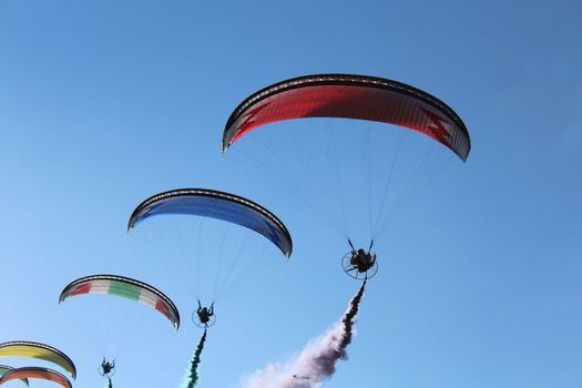 Some pilots, paragliders, make the spectacular perform