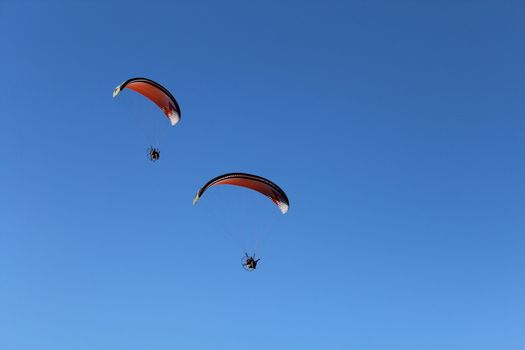 Some pilots, paragliders, make the spectacular perform