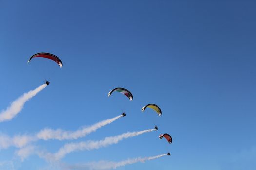 Some pilots, paragliders, make the spectacular perform