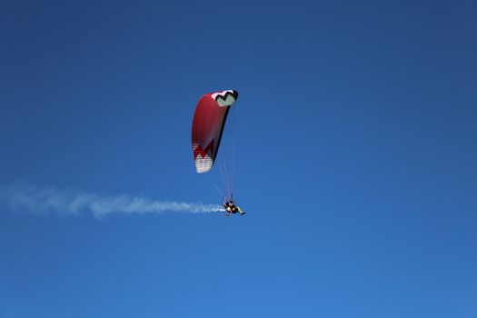 Some pilots, paragliders, make the spectacular perform