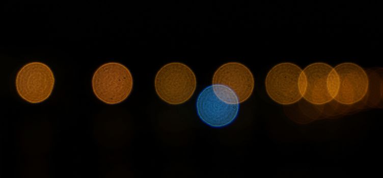 Fluorescent lights at night adjust focus until blurred photo, making the image of circular shape bokeh.
beautiful                             