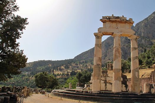 Photo shows old Delphi temple in the middle of the woods.