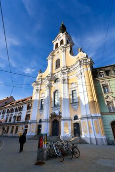 Graz, Austria - January 16, 2011: View of Brotherhood Baroque Church on Annenstrasse street in Graz, Austria