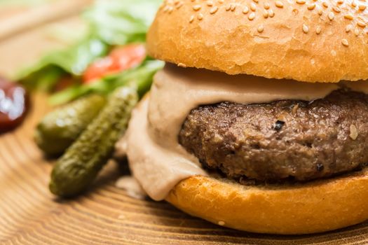 Delicious burger with beef, tomato, lettuce and fries. selective focus