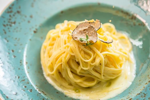 Dish of pasta with truffle. selective focus. close-up