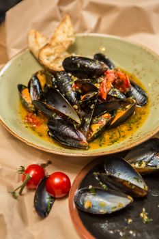 Moules Marinieres. Mussels cooked with white wine sauce. Shallow dof.