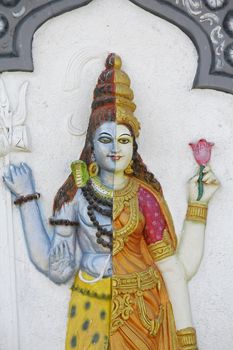 Statue of Ardhanari Nateshwar at Shrinath Mhaskoba Temple, Kodit, Sasvad, Maharashtra, India. Ardhanarishvara is a composite androgynous form of the Hindu god Shiva and his consort Parvati Ardhanarishvara is depicted as half male and half female, split down the middle. The right half is usually the male Shiva, illustrating his traditional attributes.