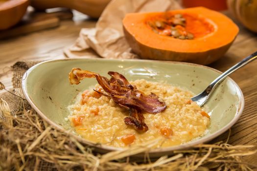 Italian risotto with grilled mushrooms and bacon. Shallow dof.