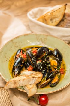 Moules Marinieres. Mussels cooked with white wine sauce. Shallow dof.