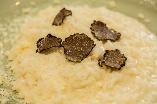 Italian risotto with black truffle. Shallow dof.