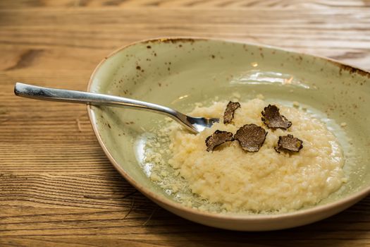 Italian risotto with black truffle. Shallow dof.