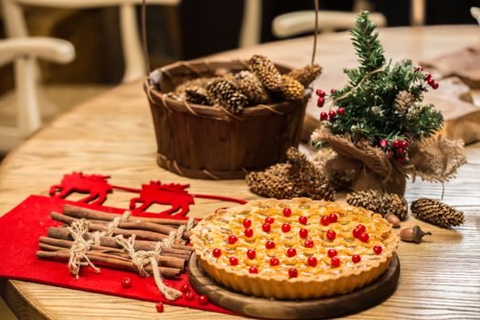 Homemade christmas cake with wild berries. Shallow dof.