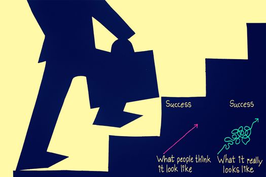 Businessman stepping up a staircase