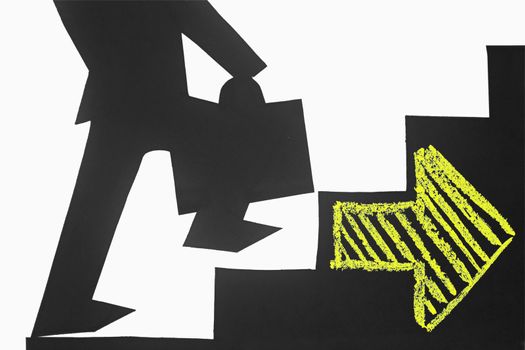 Businessman stepping up a staircase