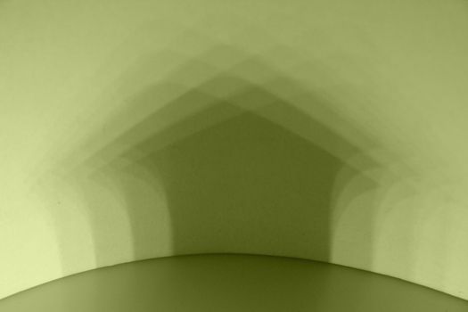 Multiple shadow of Miniature Home on wall