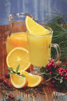 Fresh orange juice with orange slice for winter and Christmas