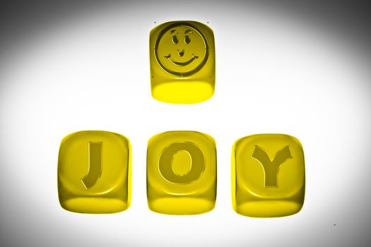 Joy symbol with word JOY on cubes