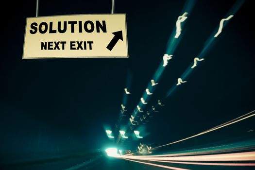 A Notice Board On A National Highway tunnel  Showing Solution Next Exit Concept