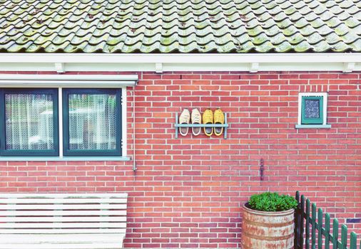 Beautiful traditional house facade  in a Netherlands with tradition shoes