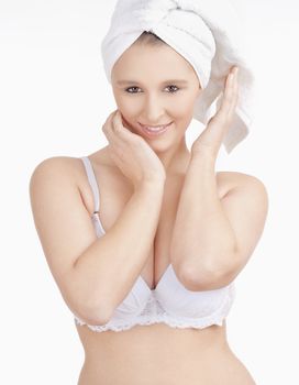 Beautiful Young Woman with Towel on her Head Smiling - Isolated on White
