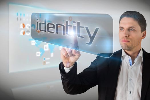 Businessman pointing to word identity against technology interface