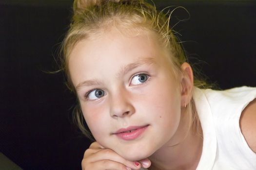 Cute girl with blond long hair and blue eyes