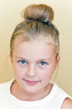 Cute girl with blond long hair and blue eyes