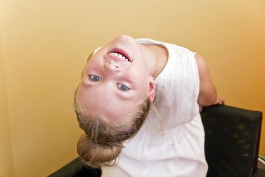 Photo of cute playing girl with blond hair