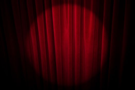 Red curtain with spotlight.