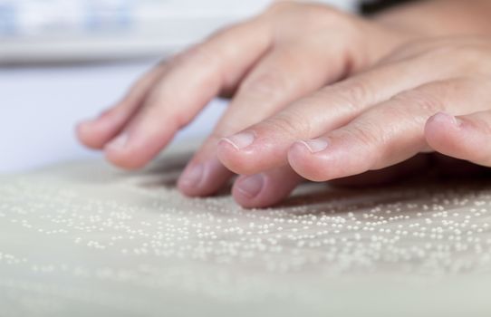 Blind reading text in braille language