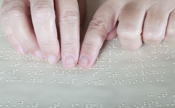 Blind reading text in braille language