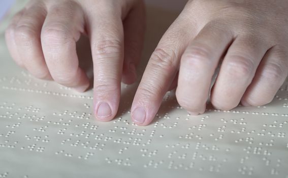 Blind reading text in braille language