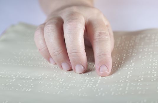 Blind reading text in braille language