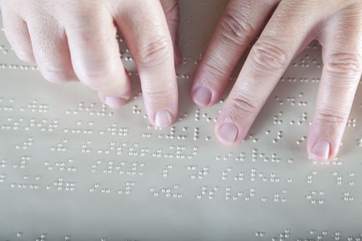 Blind reading text in braille language