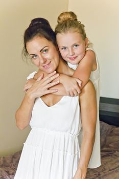 Photo of mother and daughter in white