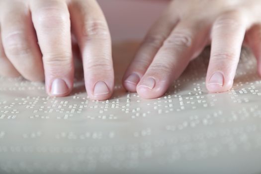 Blind reading text in braille language