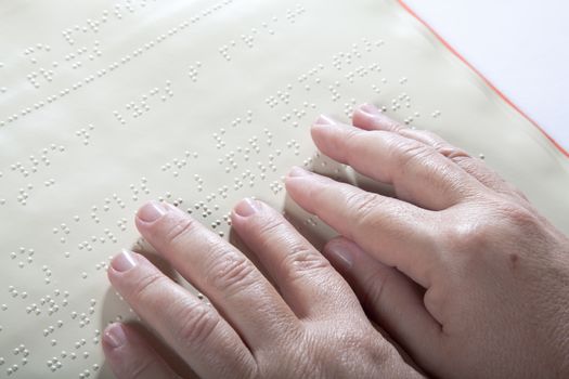 Blind reading text in braille language