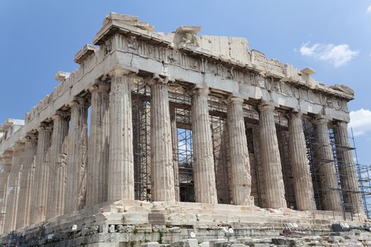 The Parthenon is a temple on the Athenian Acropolis, Greece, dedicated to the maiden goddess Athena, whom the people of Athens considered their patron deity. Its construction began in 447 BC when the Athenian Empire was at the height of its power. It was completed in 438 BC, although decoration of the building continued until 432 BC.