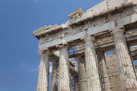 The Parthenon is a temple on the Athenian Acropolis, Greece, dedicated to the maiden goddess Athena, whom the people of Athens considered their patron deity. Its construction began in 447 BC when the Athenian Empire was at the height of its power. It was completed in 438 BC, although decoration of the building continued until 432 BC.