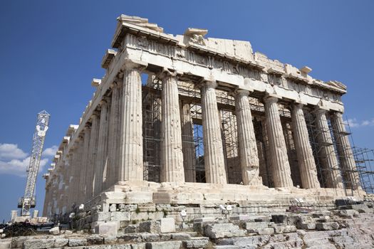 The Parthenon is a temple on the Athenian Acropolis, Greece, dedicated to the maiden goddess Athena, whom the people of Athens considered their patron deity. Its construction began in 447 BC when the Athenian Empire was at the height of its power. It was completed in 438 BC, although decoration of the building continued until 432 BC.