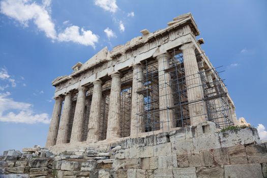 The Parthenon is a temple on the Athenian Acropolis, Greece, dedicated to the maiden goddess Athena, whom the people of Athens considered their patron deity. Its construction began in 447 BC when the Athenian Empire was at the height of its power. It was completed in 438 BC, although decoration of the building continued until 432 BC.