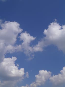 Blue sky with white clouds useful as a background