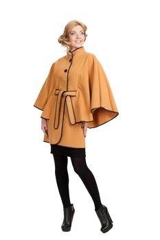 The girl in a yellow autumn coat on a white background